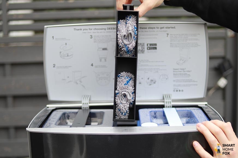 The organisation of the upper compartment of the Ecovacs Deebot Station can be seen.